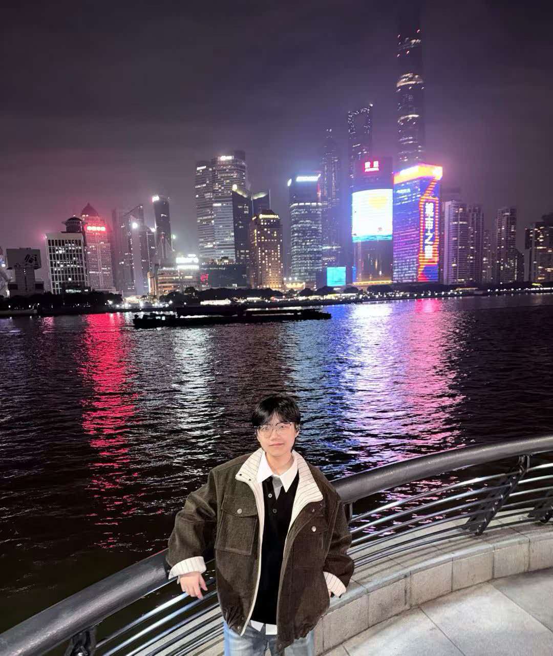Portrait by the Shanghai waterfront at night